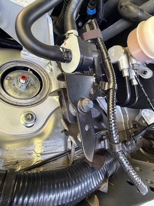Close-up of strut tower mounting bracket